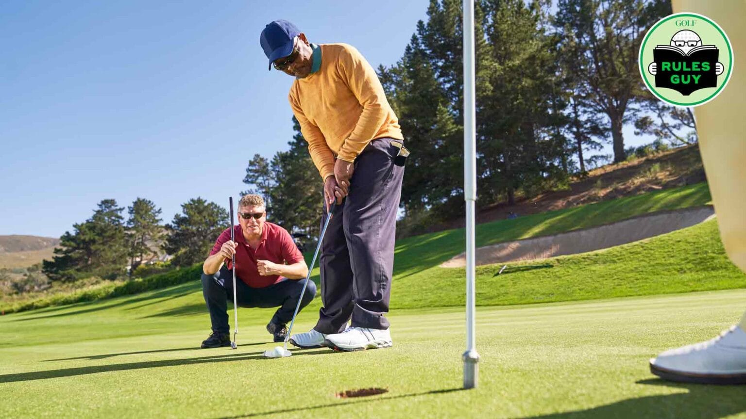 Is it allowed for another player to position themselves directly behind me while I putt?
