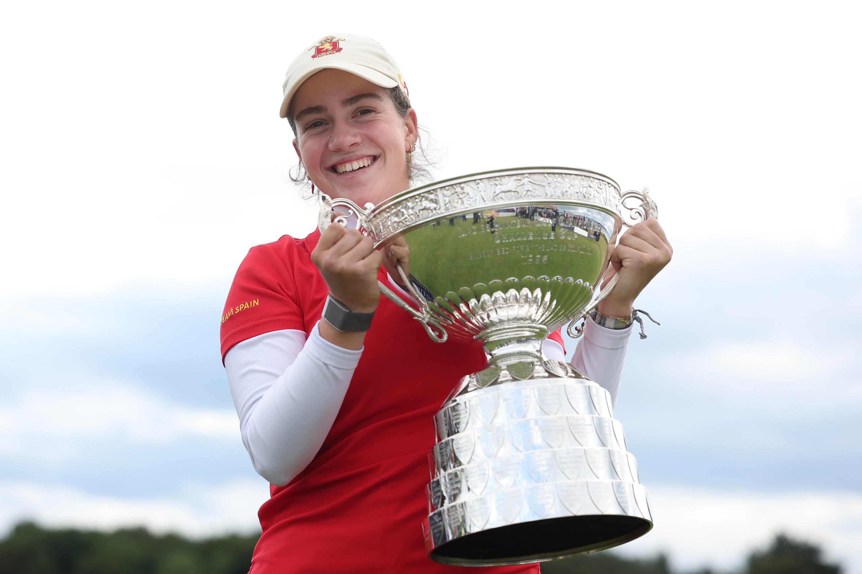 Paula Martin Sampedro of Spain holds the trophy following her victory during the Final on Day Six of the R&A Women’s Amateur Championship at Nairn Golf Club on June 15, 2025, in Nairn, Scotland.
