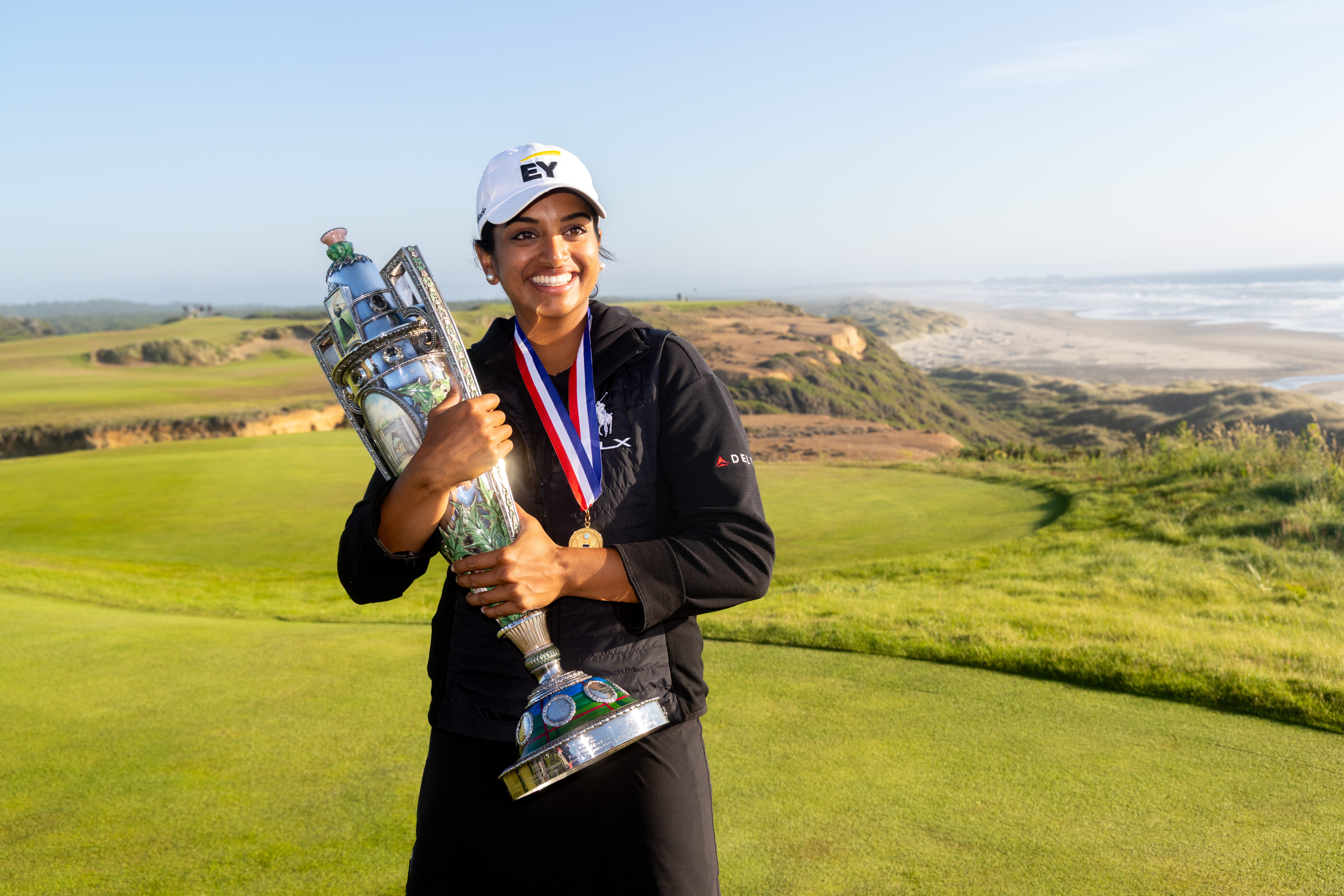 Megha Ganne poses on the 16th hole with the Patrick Cox trophy after winning the 125th US Women's Amateur at the Bandon Dunes Golf Course on August 10, 2025, in Bandon, Oregon.