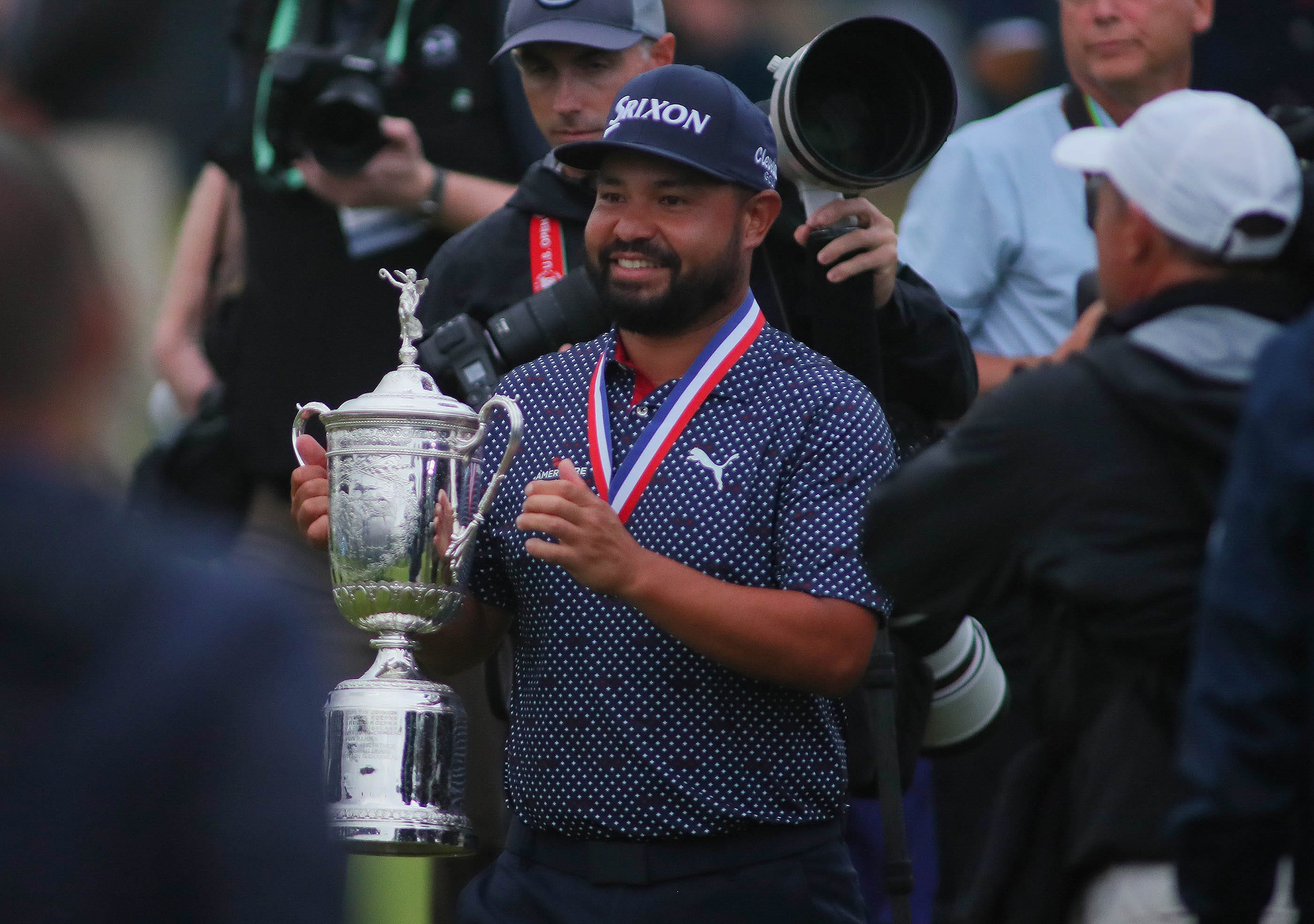 J.J. Spaun holding the U.S. Open trophy at Oakmont Country Club
